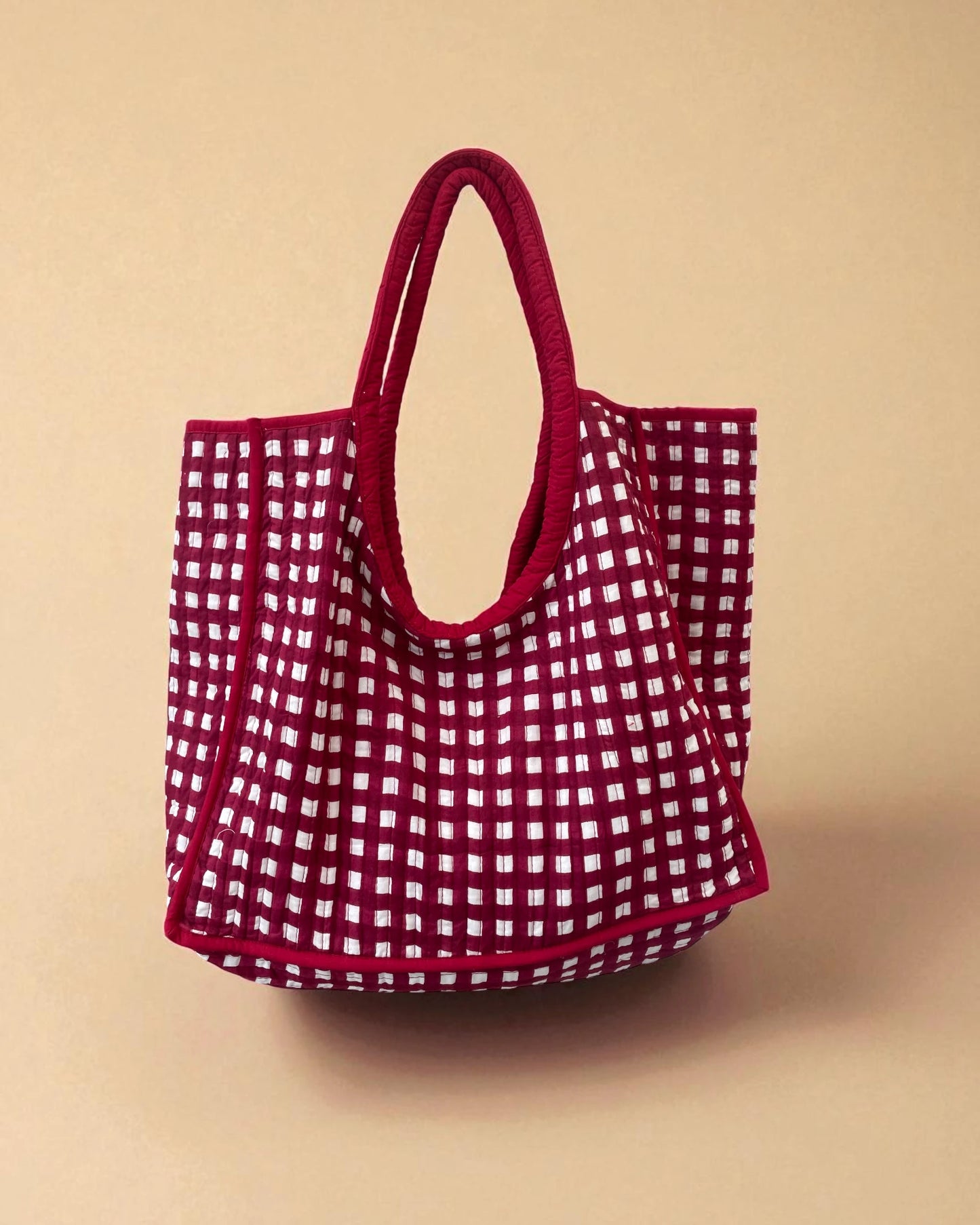 In a bright red checked gingham pattern this small to medium sized tote shopper bag is perfect for on the go