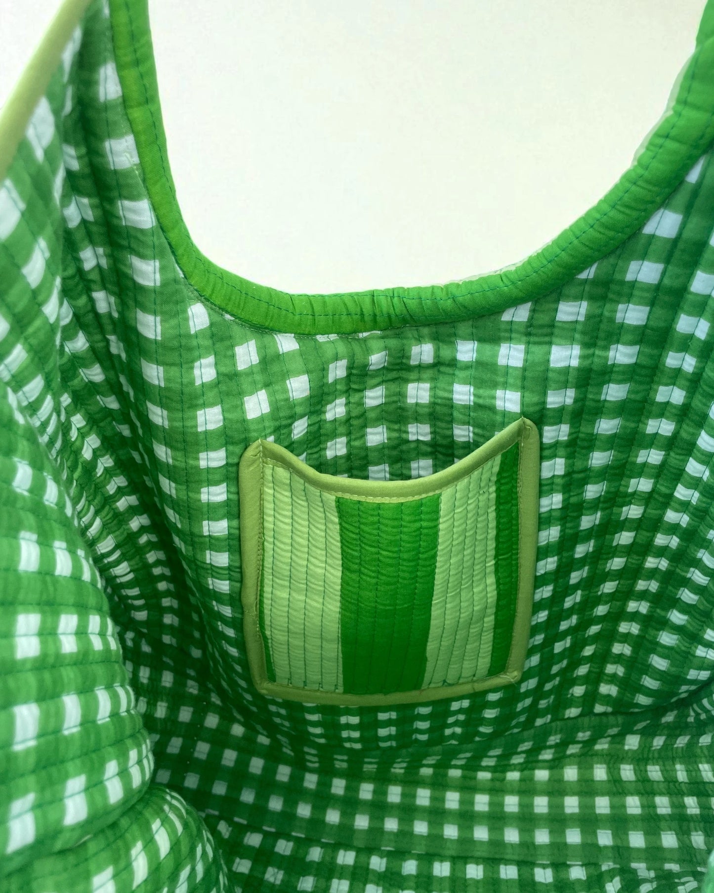 Green and white checkered fabric cotton bagwith a pocket detail