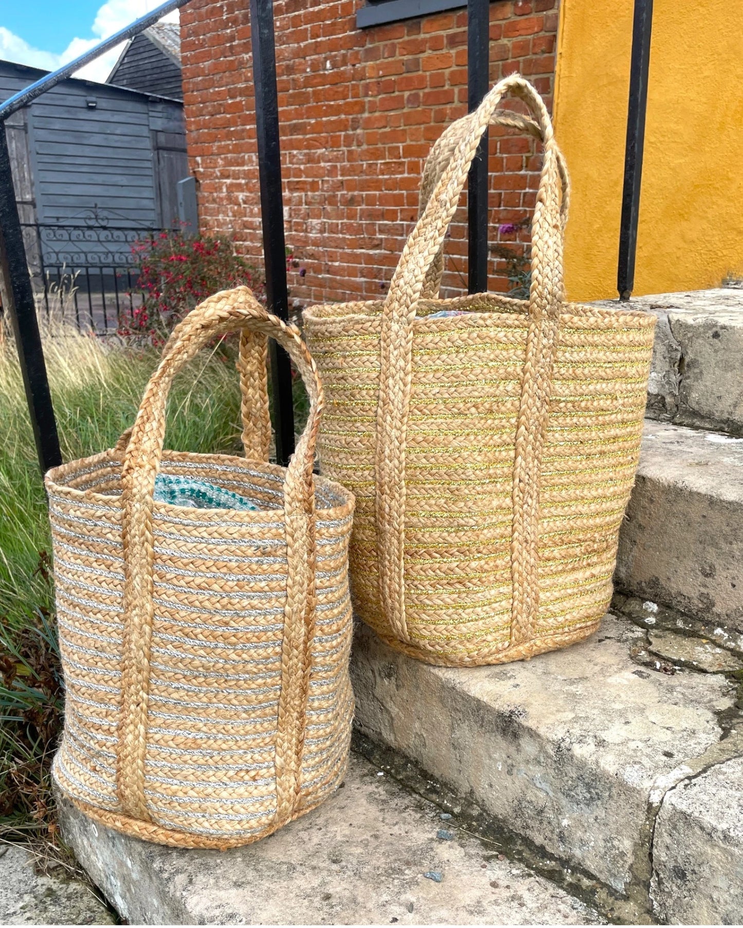 pair of woven gold and silver storage bags