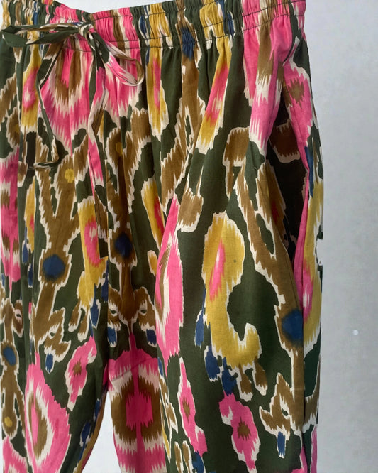 Green ikat cotton pyjama trousers with pink detailing and side pockets