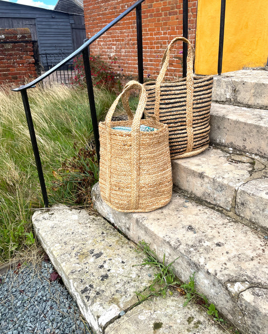 pair of monochrome and plain neutral basket bags in striped black and natural woven jute for day use, shopping, markets and the gym
