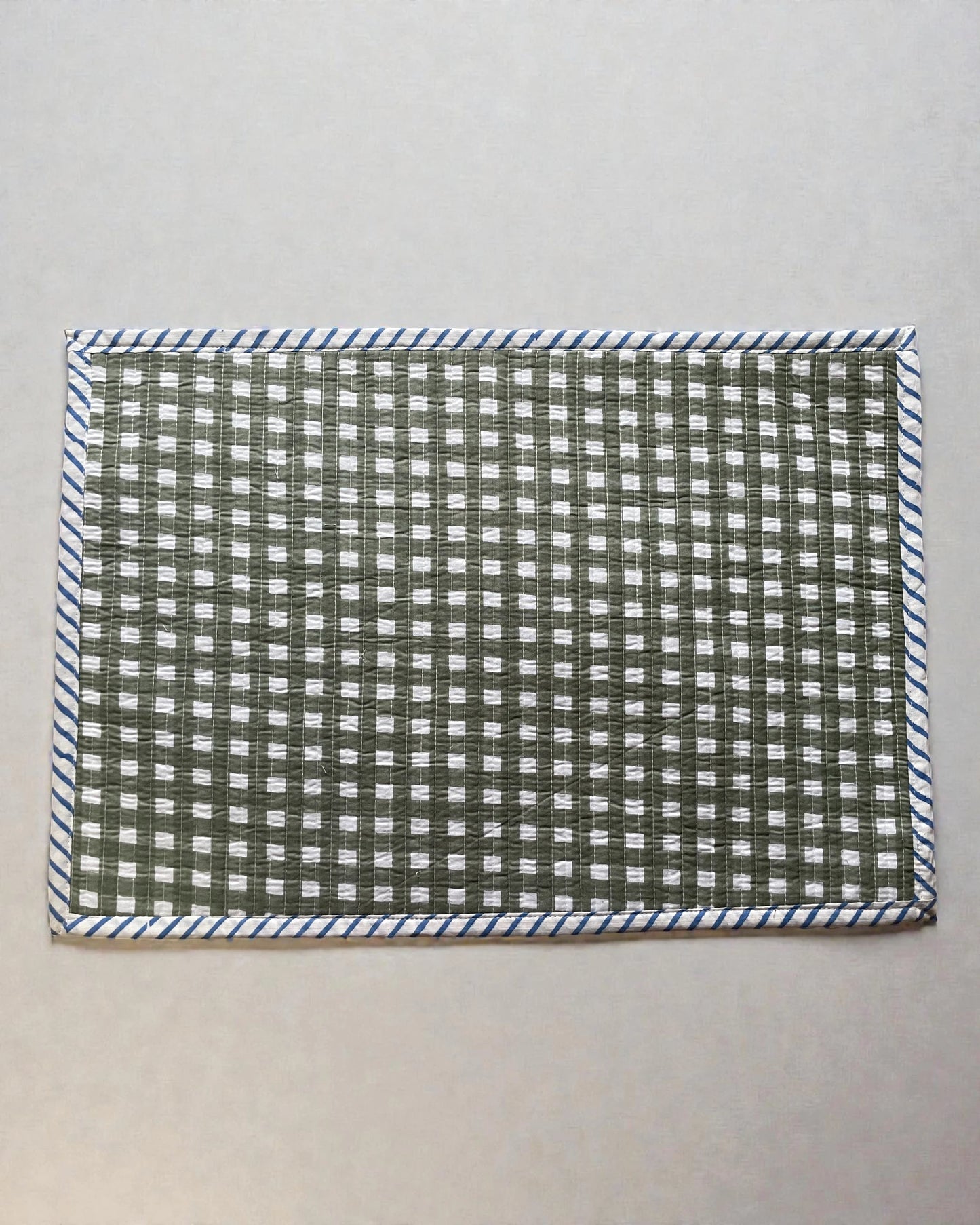 checked sage green gingham quilted cotton place mats with blue striped bordr
