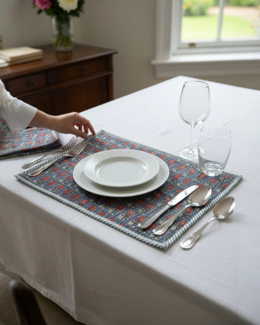 Quilted scarlet and grey cotton placemats layered over a tablecloth
