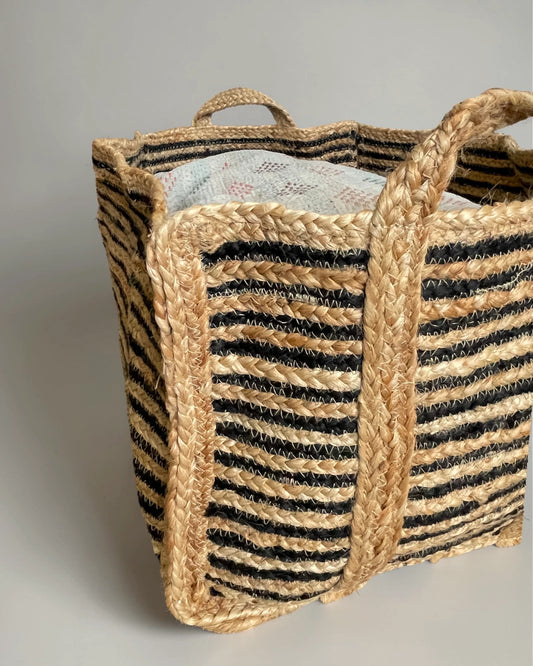 Close up texture of hand braided black and natural jute weave