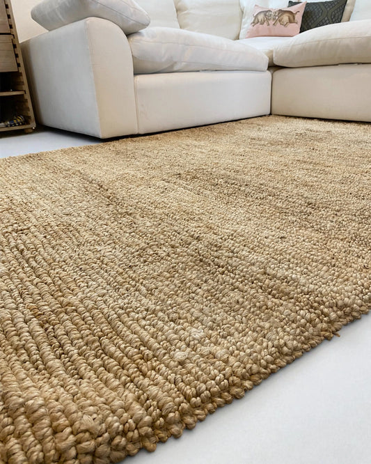 detail of textured, rustic scandi natural jute floor rug 5ft by 7ft large size