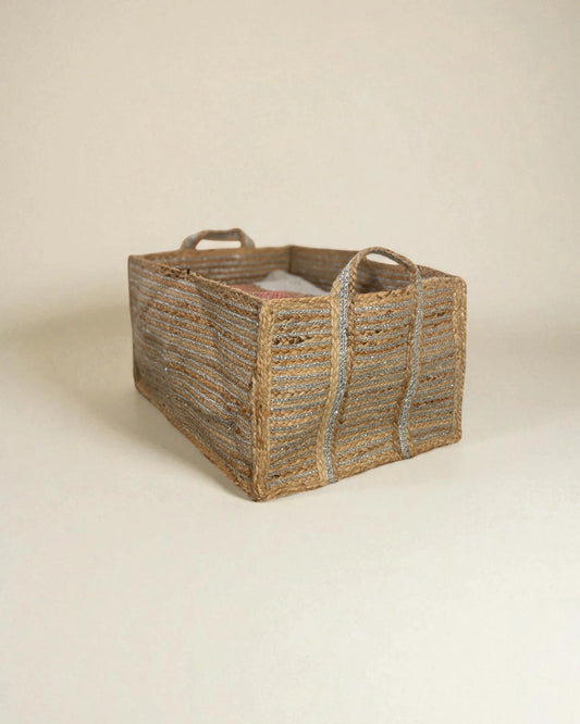 Woven extra large storage basket with handles on a beige background