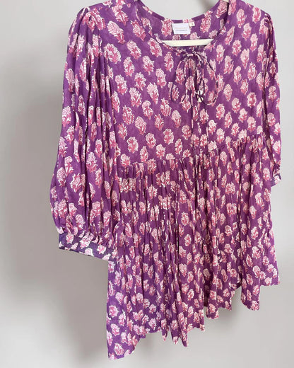 Side view of the Amethyst hand block print cotton mini dress with gathered skirt and puffed three quarter (3/4) length sleeves