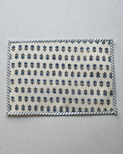 blue floral butti quilted cotton placemats with a striped blue and white border 