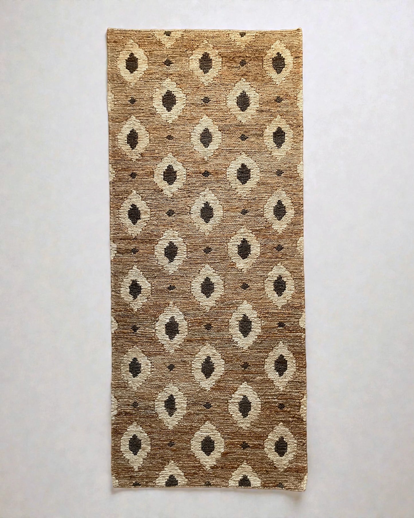 Bagheera jute runner rug cut out on a neutral background showing flat woven Oushak plaited texture and subtle leopard pattern