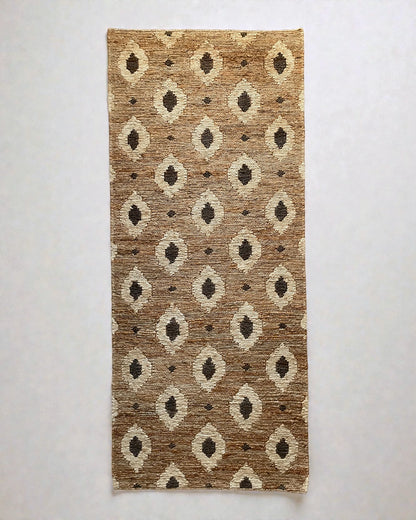 Bagheera jute runner rug cut out on a neutral background showing flat woven Oushak plaited texture and subtle leopard pattern