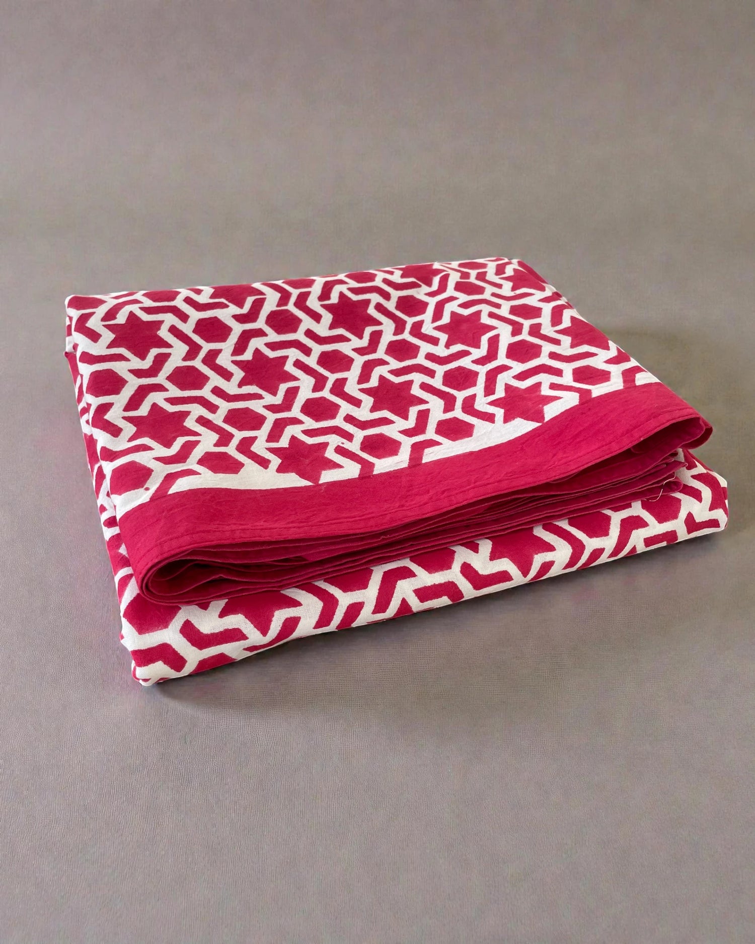 Crimson red and white geometric cotton tablecloth with bold repeating pattern