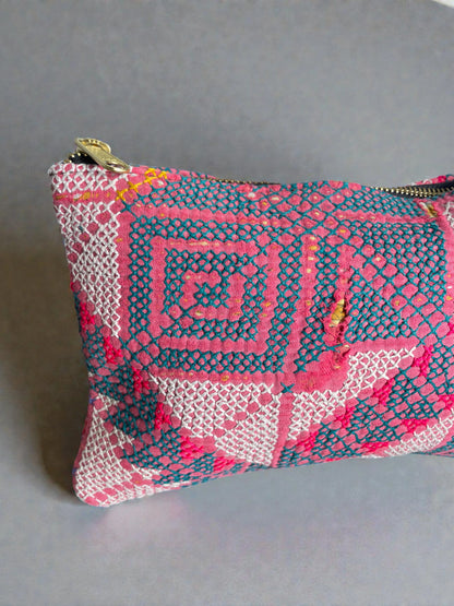 Soft kantha travel makeup bag with bright pink and teal pattern and zipper closure