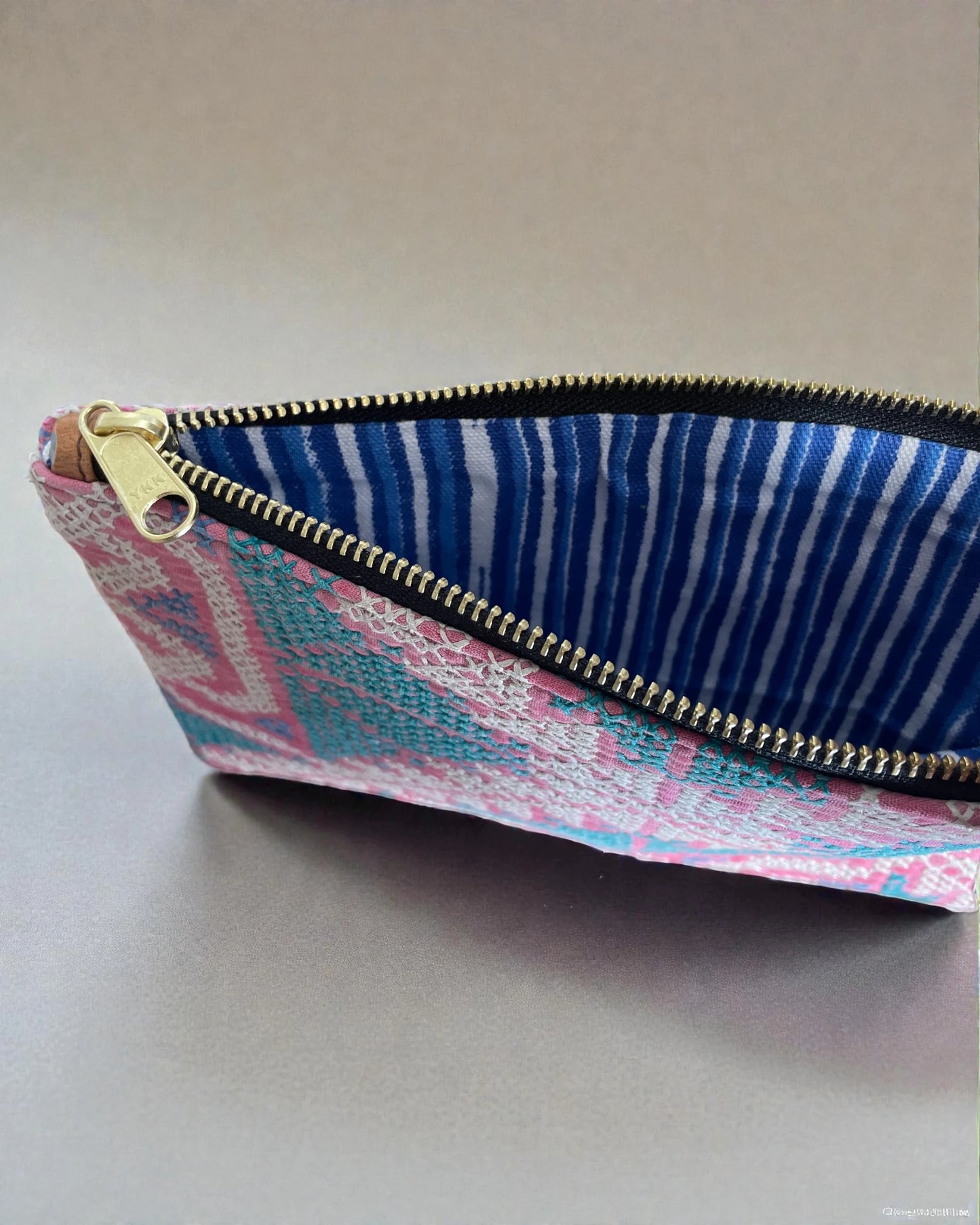 canvas interior and brass zip to travel pouch