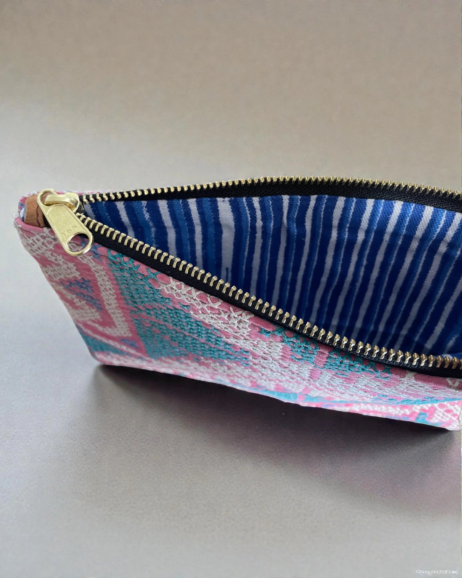 canvas interior and brass zip to travel pouch