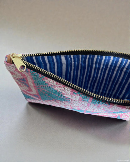 canvas interior and brass zip to travel pouch