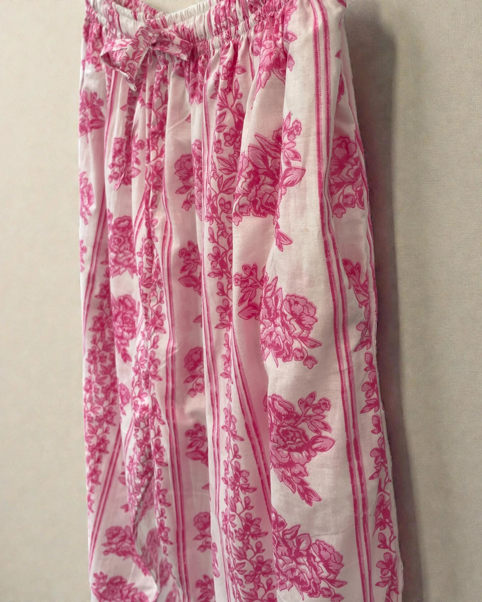 Pink floral cotton pyjama trousers with striped border and soft breathable fabric