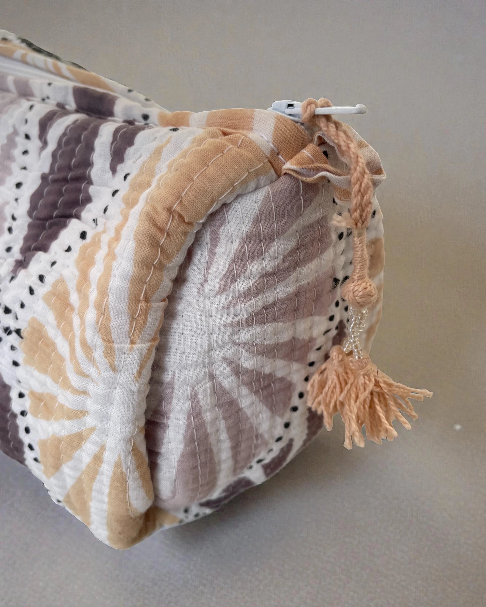 large pastel block print cosmetic pouch with tassel zip detail