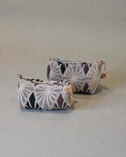 quilted cotton toiletry bag in soft pink and neutral tones with shell-style pattern