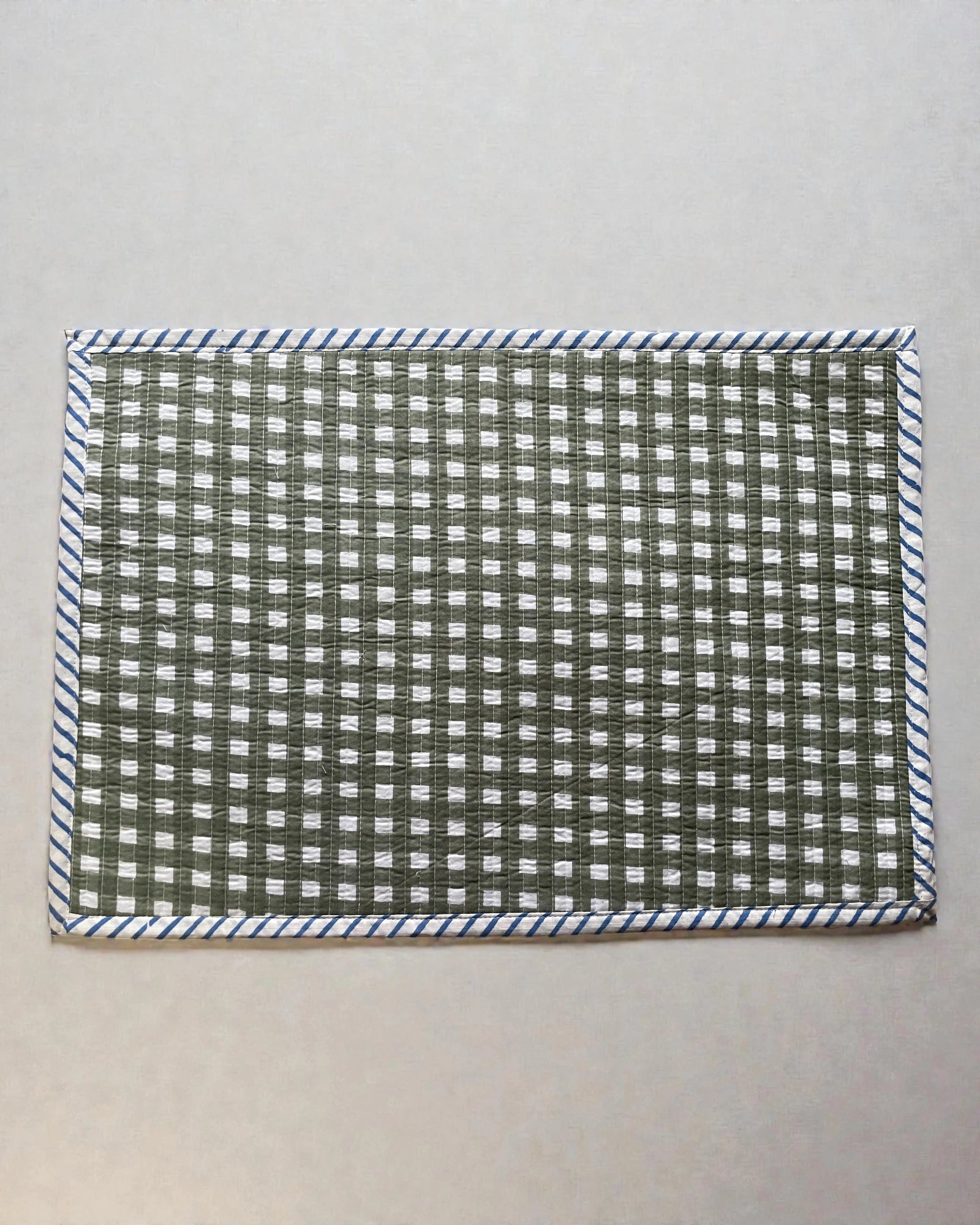 checked sage green gingham quilted cotton place mats with blue striped bordr