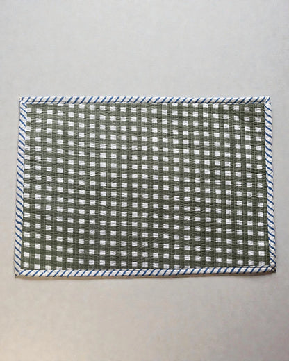 checked sage green gingham quilted cotton place mats with blue striped bordr