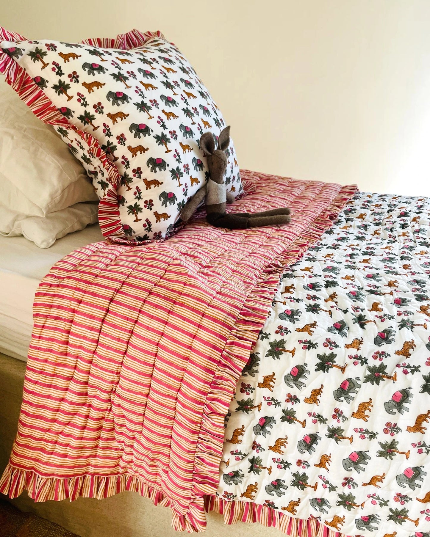 Ranthambore handmade kids cotton quilt set styled on bed with matching cushions in 100% cotton bedding