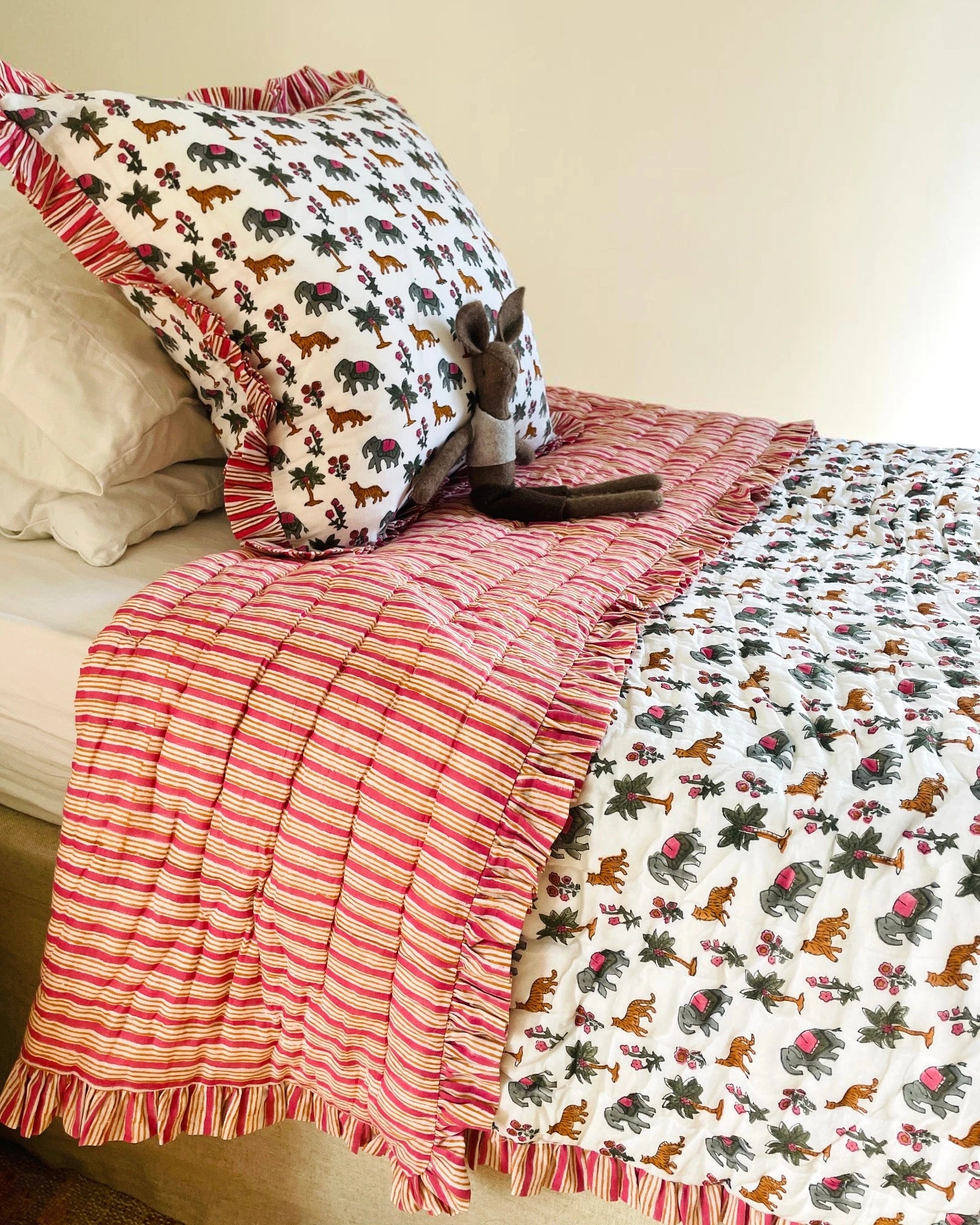 Ranthambore handmade kids cotton quilt set styled on bed with matching cushions in 100% cotton bedding