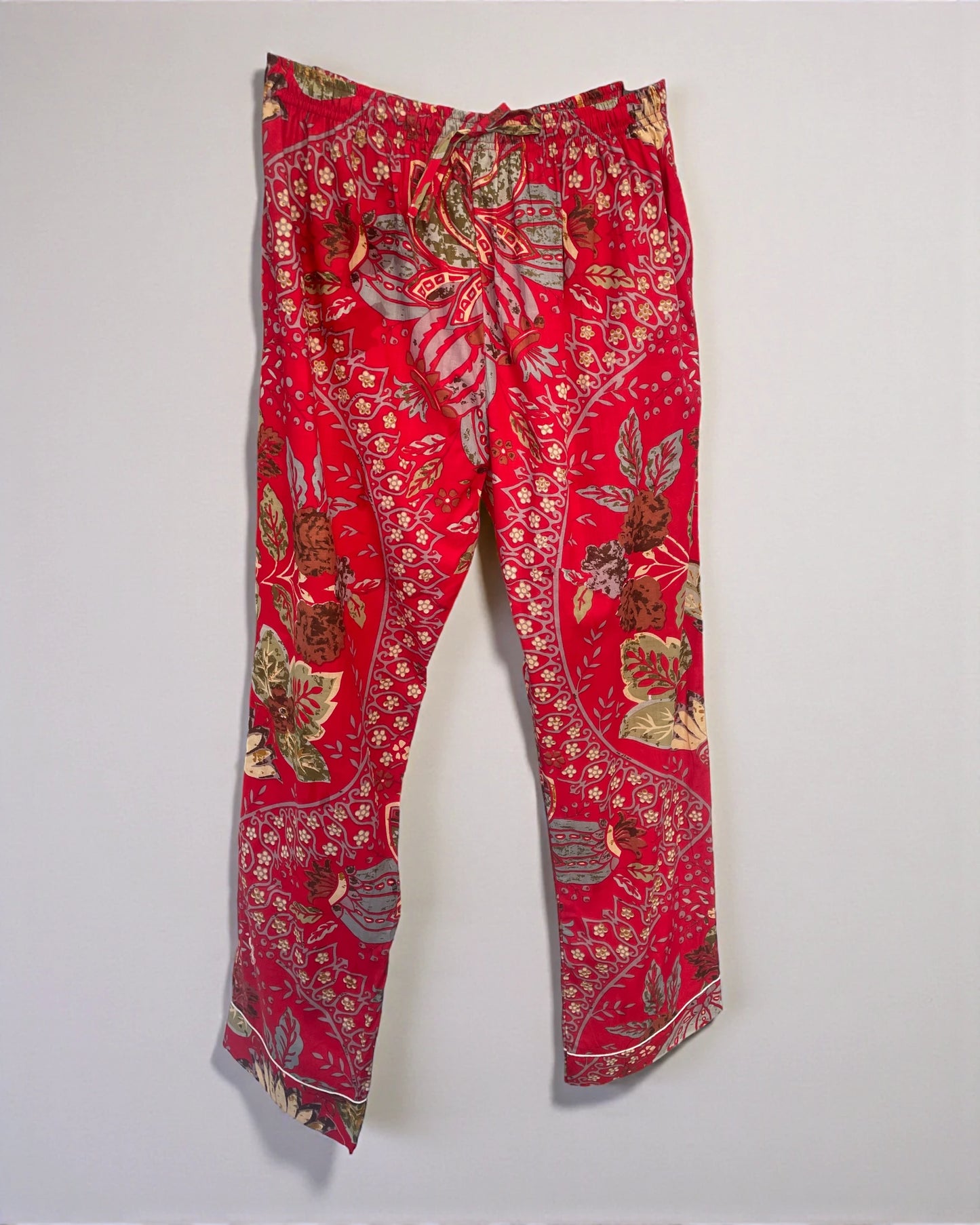 Red floral cotton pyjamas featuring a button front shirt and drawstring trousers