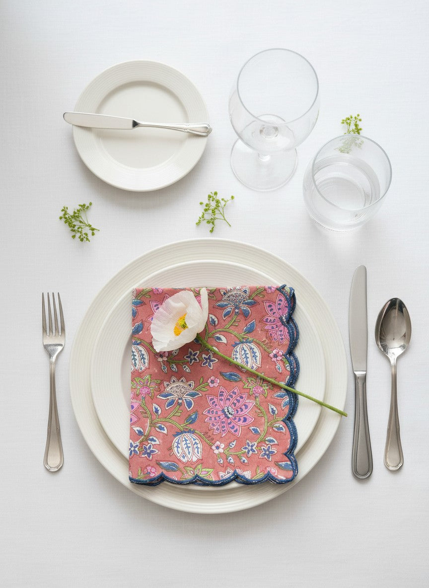 Scalloped-edge cotton napkins in muted red and navy blue, perfect for everyday dining and entertaining
