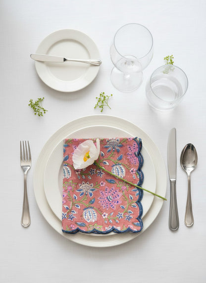 Scalloped-edge cotton napkins in muted red and navy blue, perfect for everyday dining and entertaining