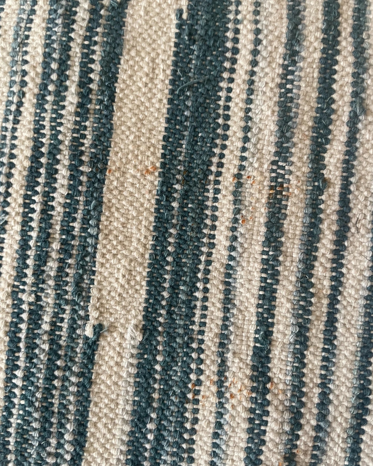 detail of imperfection on rug