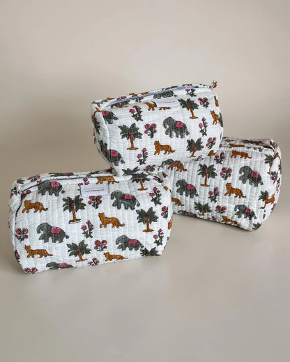 Set of three quilted wash bags in matching design, soft fabric cosmetic and toiletry pouches for travel and everyday organization