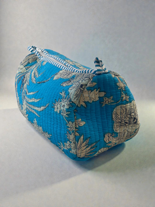 Turquoise quilted cosmetics bags with floral print and waterproof interior lining