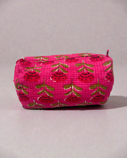 three-piece pink quilted toiletry bag set featuring floral pattern and beaded tassel zips