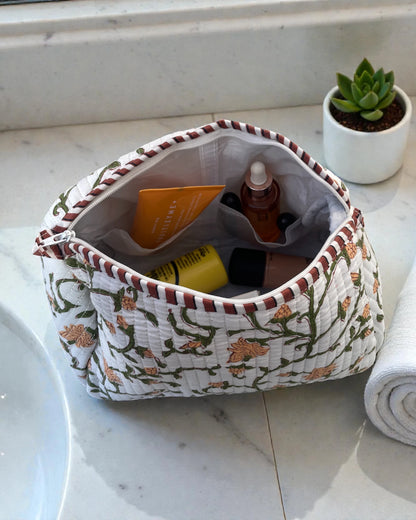 waterproof lined quilted cotton makeup bags featuring a green floral vine print with striped binding, four compartments and zip