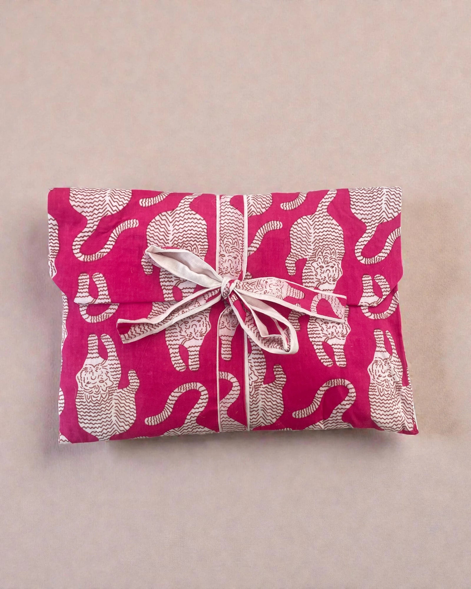 pink animal-print women’s pyjama set with button shirt, shorts, and coordinating fabric gift bag